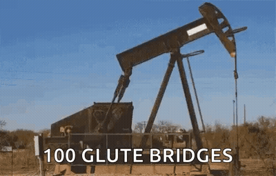 A Large Oil Pump In The Middle Of A Field With The Words `` 100 Glute Bridges '' Above It . GIF