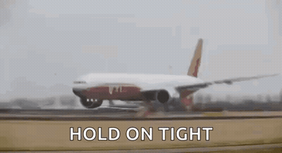 A Large Passenger Jet Is Taking Off From An Airport Runway With The Words `` Hold On Tight '' Written Above It . GIF