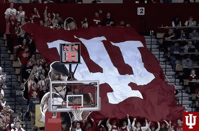 A Large Red And White Flag With The Letters Ii On It GIF