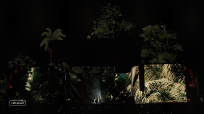 A Large Screen At A Concert Says Gazelle On The Bottom GIF