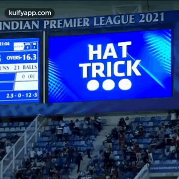 A Large Screen In A Stadium Says Hat Trick On It . GIF