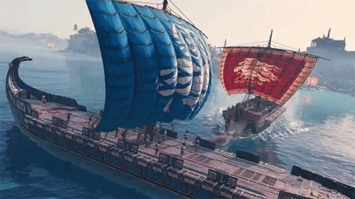 A Large Ship With A Blue Sail And A Red Sail Is In The Water GIF