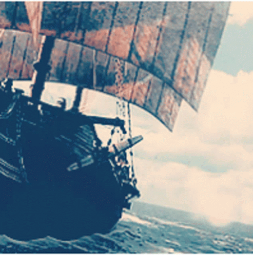 A Large Ship With A Large Sail Is Floating On The Water GIF