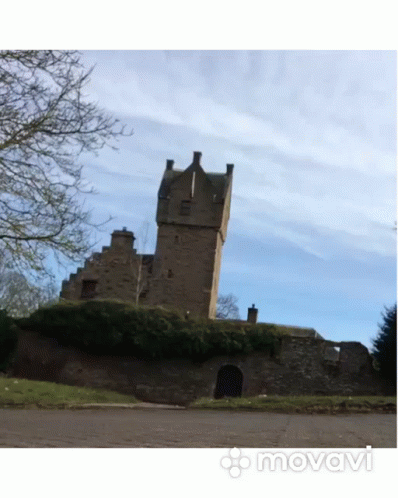 A Large Stone Building With A Blue Sky In The Background And The Word Movavi On The Bottom GIF