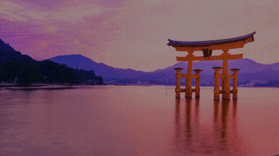 A Large Torii Gate Is In The Middle Of A Body Of Water GIF