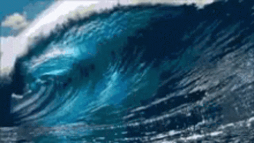 Large Wave Crashing On Beach Shore GIF