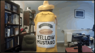 A Large Yellow Bottle Of Yellow Mustard In A Room GIF