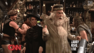 A Larry King Live Advertisement With A Witch And Wizard GIF