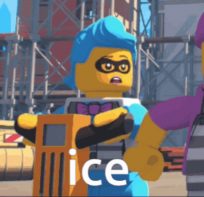 A Lego Character With Blue Hair Is Holding An Orange Object And The Word Ice Is On The Bottom GIF