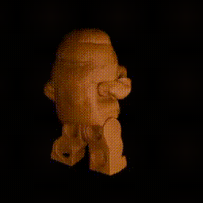 a lego figure is standing in the dark