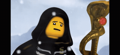 A Lego Figure With A Black Cape And A Yellow Face Is Standing Next To A Gold Snake GIF