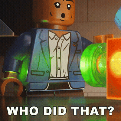A Lego Man In A Suit Is Standing Next To A Green Object That Says Who Did That On It GIF