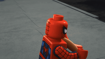 A Lego Spider-Man Holding A Hot Dog With Yellow Lines Around His Head GIF