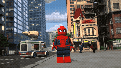 A Lego Spider Man Stands On A City Street With A Pizza Truck In The Background GIF