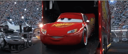 A Lightning Mcqueen From Cars Is Being Loaded Into A Trailer GIF