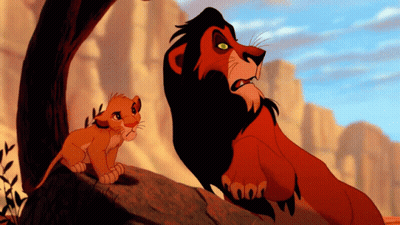 A Lion And A Cub From The Lion King Are Standing Next To Each Other GIF