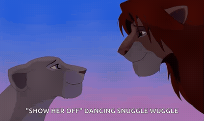 A Lion And A Lioness Are Looking At Each Other And The Lioness Is Saying " Show Her Off " GIF