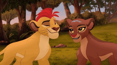A Lion And A Lioness Are Standing Next To Each Other GIF