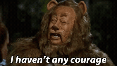 A Lion From The Wizard Of Oz Is Talking To A Woman And Saying `` I Haven 'T Any Courage '' . GIF