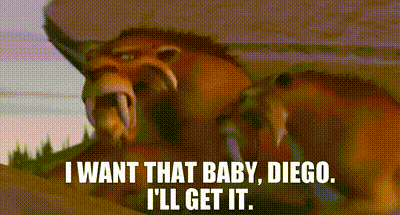 A Lion Is Laying Down With The Words I Want That Baby Diego I 'Ll Get It . GIF