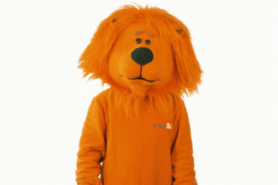A Lion Mascot Wearing An Orange Sweater With Ing Written On It GIF