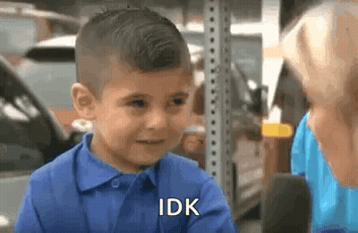 A Little Boy In A Blue Shirt Is Talking To A Woman . GIF