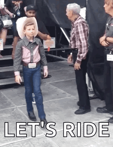 A Little Boy In A Cowboy Outfit Is Walking On A Stage With The Words Let 'S Ride Written On The Bottom GIF