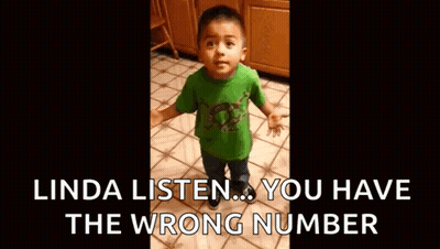 A Little Boy In A Green Shirt Is Crying While Standing On A Tile Floor . GIF