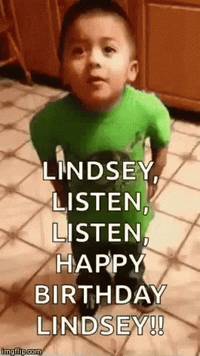 A Little Boy In A Green Shirt Is Standing On A Tiled Floor And Making A Funny Face . GIF