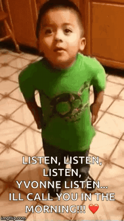 A Little Boy In A Green Shirt Is Standing On A Tiled Floor And Saying Listen , Listen , Listen . GIF