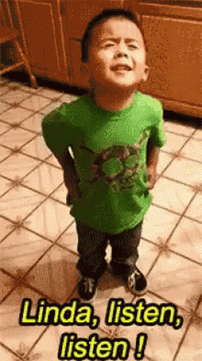 A Little Boy In A Green Shirt Is Standing On A Tiled Floor And Says Linda Listen Listen GIF