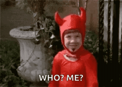 A Little Boy In A Red Devil Costume Is Asking Who ? Me ? GIF