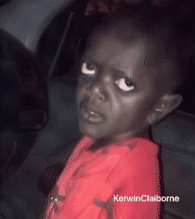 A Little Boy In A Red Shirt With Kerwinclaiborne Written On The Bottom Right GIF