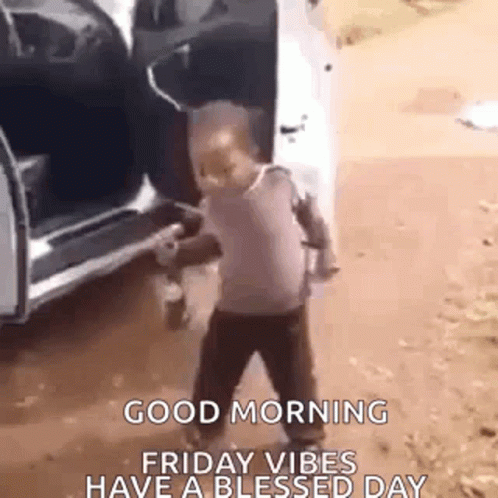 A Little Boy Is Dancing In Front Of A Car With The Door Open . GIF