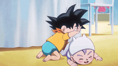 A Little Boy Is Playing With A Baby In A Diaper GIF