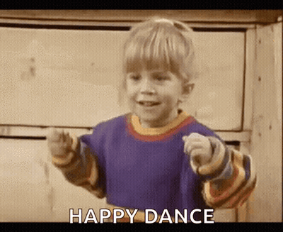 A Little Boy Is Pointing At The Camera And Saying `` Happy Dance '' While Dancing . GIF