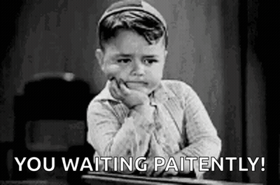 A Little Boy Is Sitting At A Desk With His Hand On His Chin And The Words `` You Waiting Patiently '' . GIF