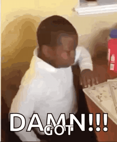 A Little Boy Is Sitting At A Table With The Words `` Damn !!! '' Written On The Screen . GIF
