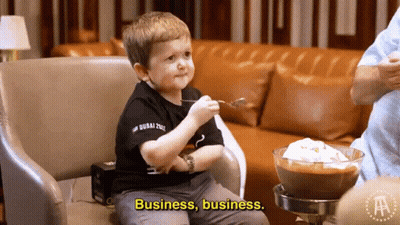 A Little Boy Is Sitting In A Chair With A Bowl Of Food And The Words Business Business On The Bottom GIF