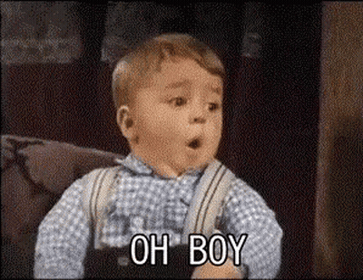 A Little Boy Is Sitting On A Couch Making A Surprised Face And Saying Oh Boy . GIF