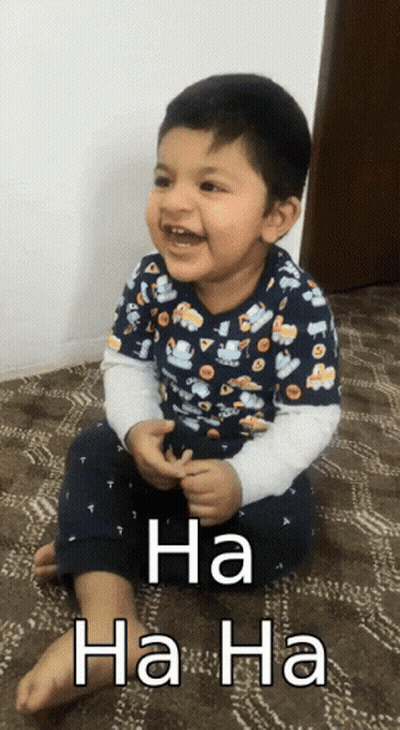 A Little Boy Is Sitting On The Floor With The Words Ha Ha Ha Written On The Bottom GIF