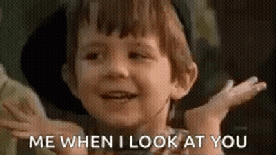 A Little Boy Is Smiling And Saying `` Me When I Look At You '' With His Hands Outstretched . GIF