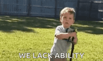 A Little Boy Is Standing In The Grass Holding A Sword And Says `` We Lack Ability '' . GIF