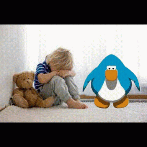A Little Boy Sitting On The Floor With A Teddy Bear And A Penguin GIF