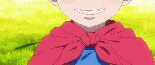 A Little Boy Wearing A Red Cape And A Blue Shirt Is Smiling . GIF