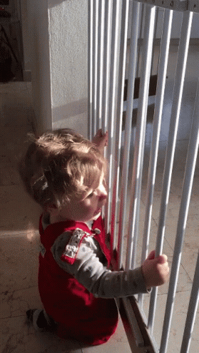 A Little Boy Wearing A Red Vest That Says ' U.s. Air Force ' On It GIF