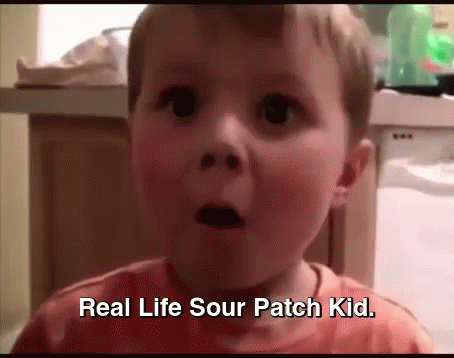 A Little Boy With A Surprised Look On His Face And The Words Real Life Sour Patch Kid Below Him GIF