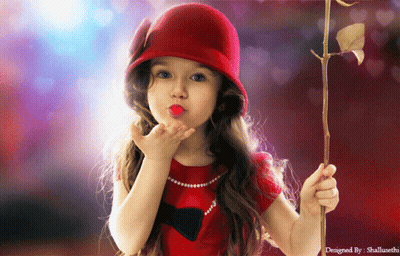 A Little Girl Blowing A Kiss While Holding A Rose In Her Hand GIF