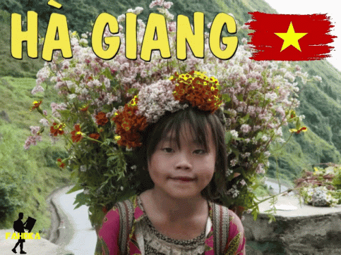 A Little Girl Carrying Flowers On Her Head With The Word Ha Giang Behind Her GIF