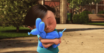 A Little Girl Holding A Blue Balloon Dog GIF